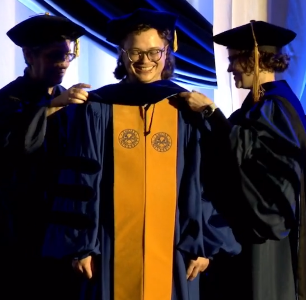em hooding at commencement